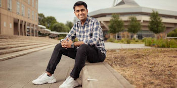 student sat in front of central hall